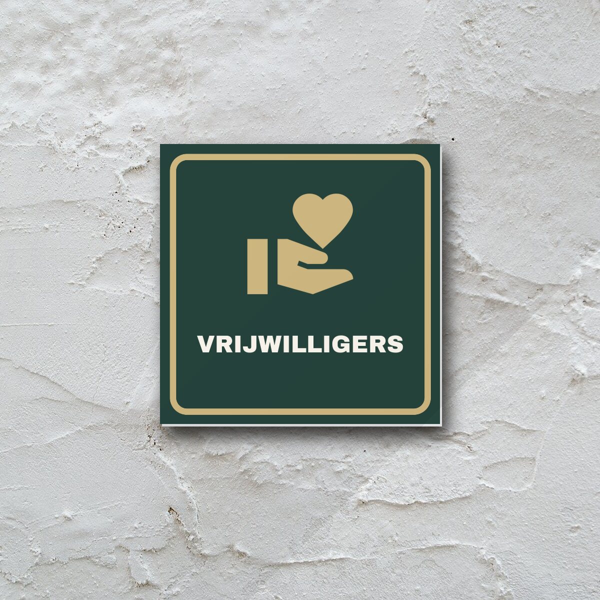 Deurbordje Vrijwilligersruimte aan de muur
